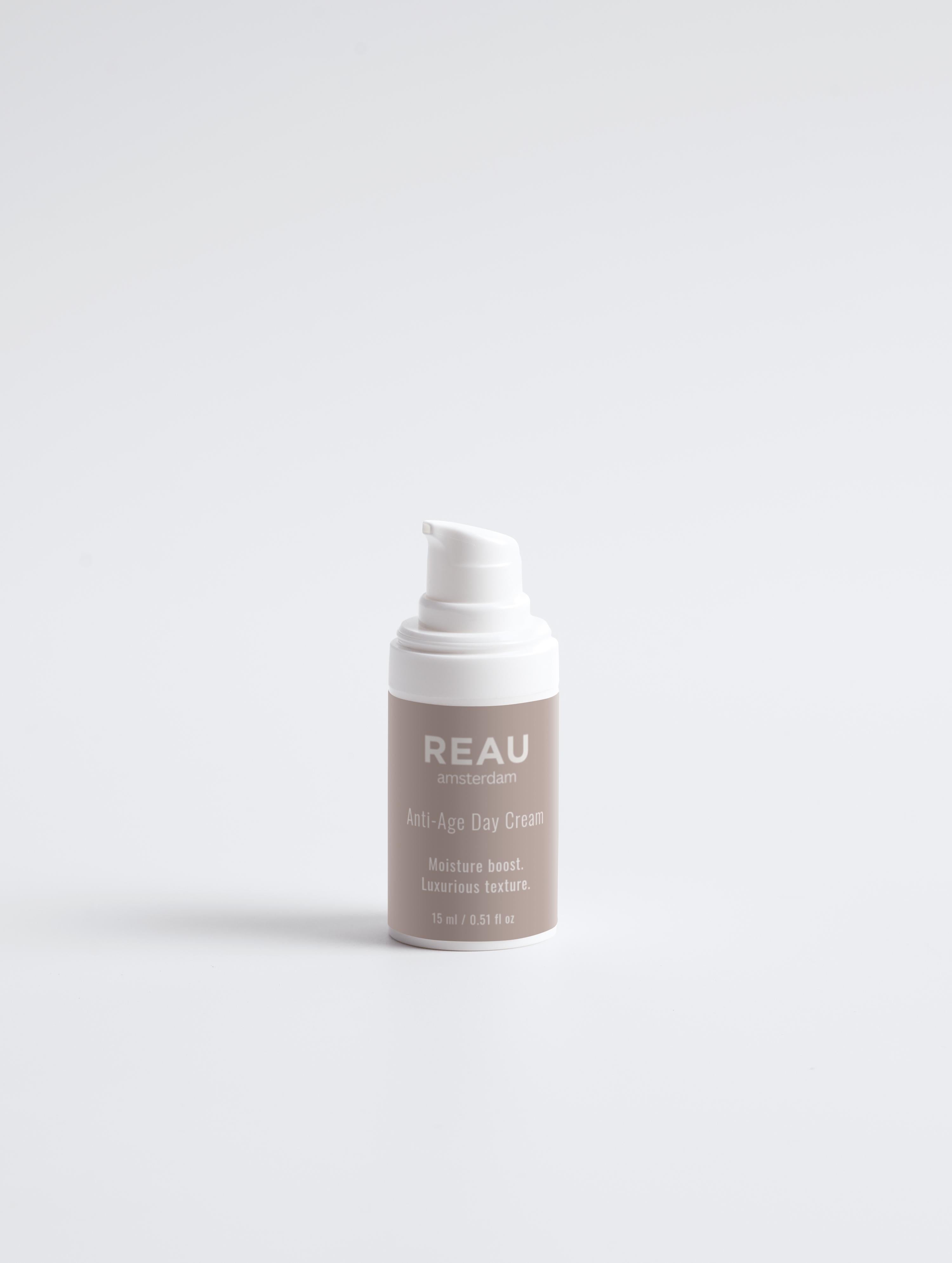 Skincare bottle labeled 'REAU' on a white background
