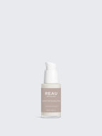 Skincare bottle labeled 'REAU' on a light gray background