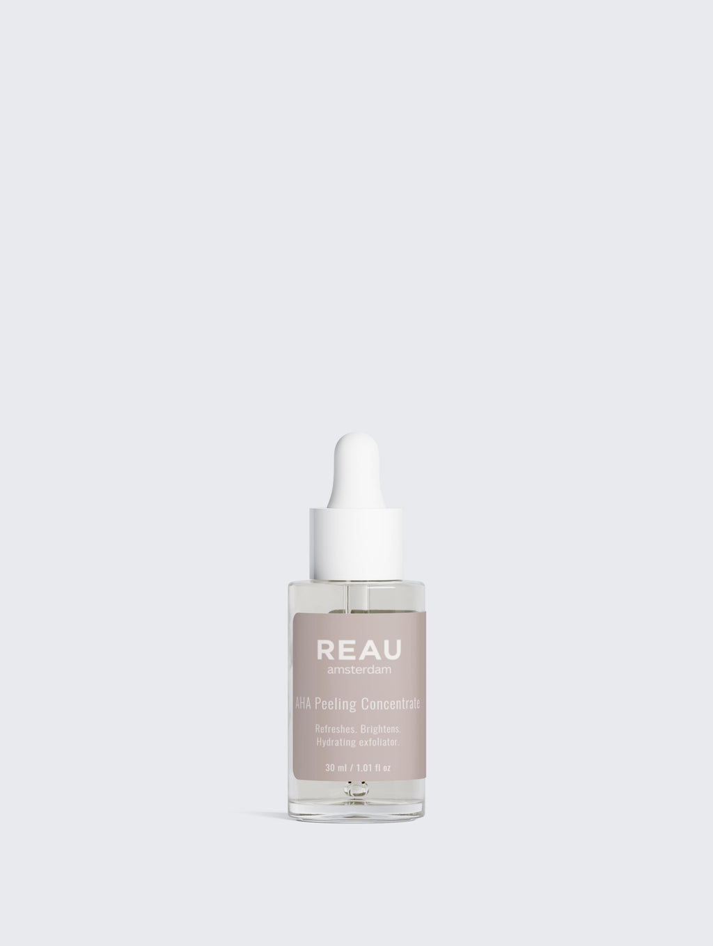 Skincare serum bottle with 'REAU' branding on a light gray background